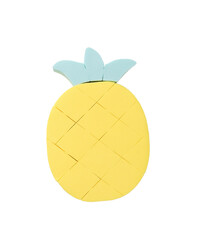 Pineapple figurine made of foam sponges isolated on a white background.