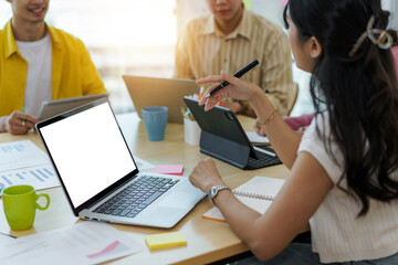 Fototapeta premium Group of young Asian business people meeting in casual wear working together on new project.