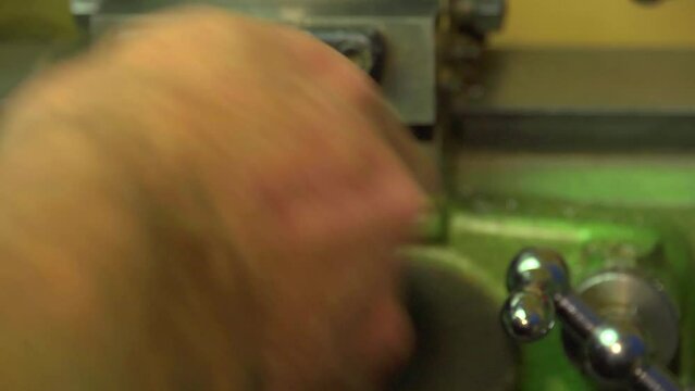 turning the feed handle on a lathe, close up