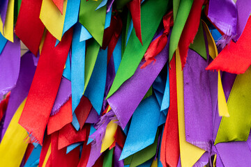 Background texture of a bright and colorful background from colored ribbons.