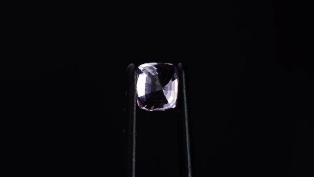 natural pink spinel gem stone on the turning table