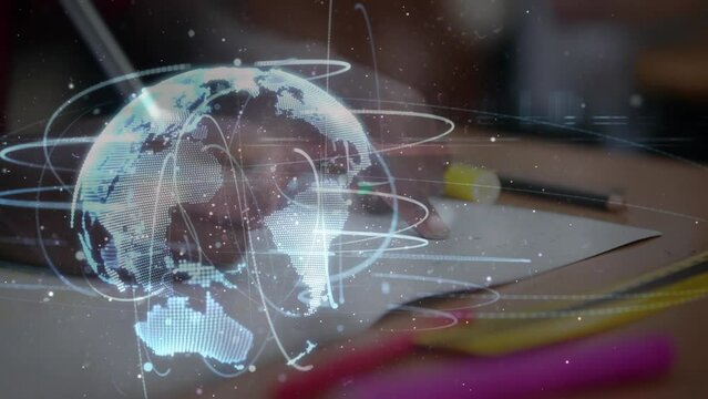 Animation of globe of network of connections over school child writing
