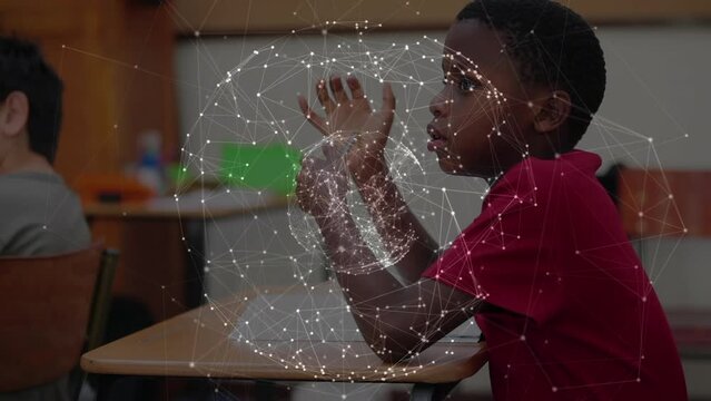 Animation of globe with network of connections over schoolboy writing