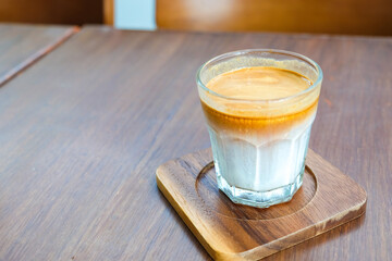 Close up hot coffee cup on wood table.