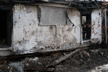 House destroyed by fire. Burnt wooden house.