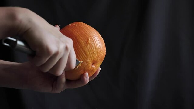 Peel a grapefruit peel on a black background
