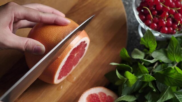 Slicing citrus fruit grapefruit