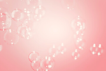 Transparent Shiny Soap Bubbles  Floating on Pink Background. Soap Sud Bubbles Water.
