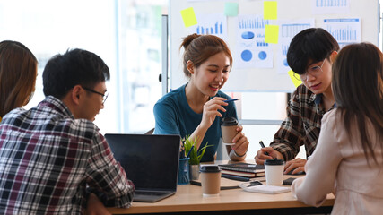 Startup business team brainstorming and discussing ideas of the new startup project together at modern office.