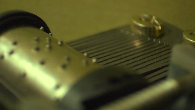 Extreme close up of a music box movement, seamless loop