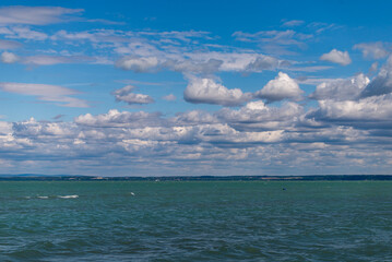 Balaton Lake in Siofok, Hungary. Dramatic Cloudy sky and blue, tourquise water.