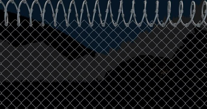 Animation of fence with barbed wire over view of mountains