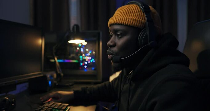 Secret agent sits in front of computer at night, man works on software, internet database, decrypts computer codes, cyber attack, website hacking, mission success revealing guarded data.