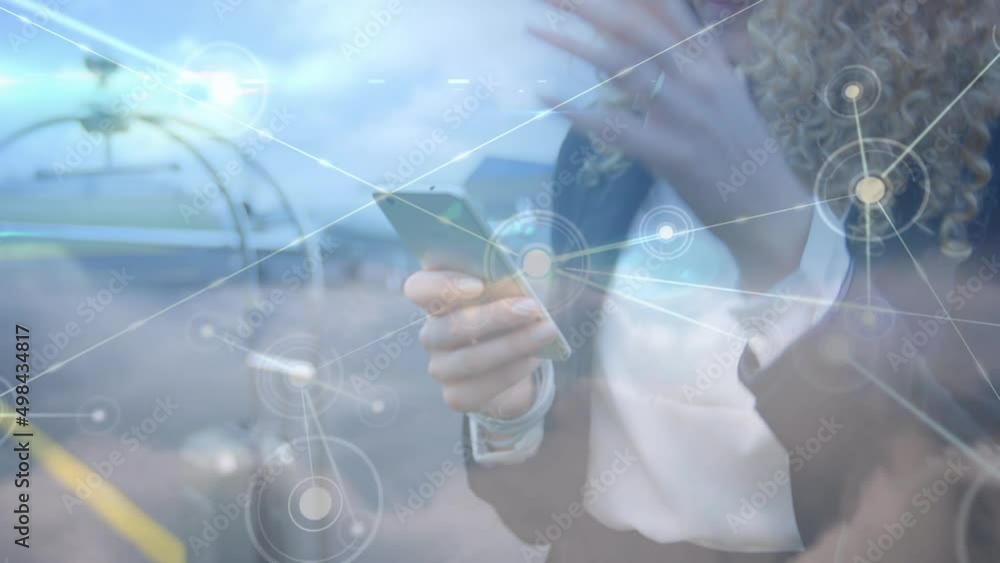 Poster Animation of data processing and clouds over caucasian businesswoman using smartphone