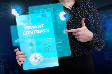 Business, Technology, Internet and network concept. Young businessman working on a virtual screen of the future and sees the inscription: Smart contract