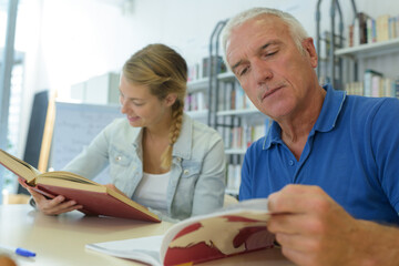 man and woman in the library