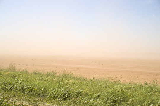 Defocused image. Desert sandstorm. Dust and sand in the air.
