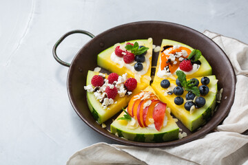 Watermelon pizza with berries, fruit, yogurt, feta cheese