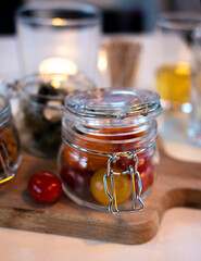 Glass jars with healthy party snacks served in bar, tasty appetisers