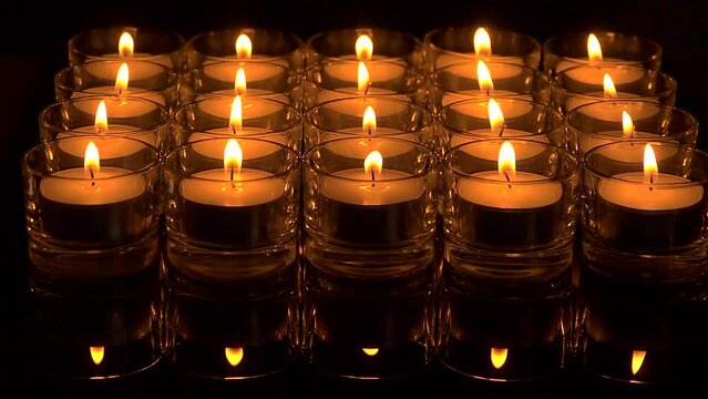 In memoriam, seamless loop.  Remembrance candles flickering