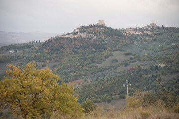 View on hills of Rocco Tuscany, Italy. Tuscan landscape with cypress trees, vineyards, forests and...
