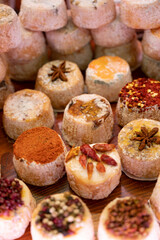 Variety of French soft goat cheese with different toppings, indian, curry, pepper, spicy