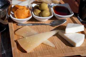 Dinner at guachinche, typical Canary Island establishment on Tenerife, where locally produced white or red wine served accompanied by homemade traditional food, tapas and goat cheese