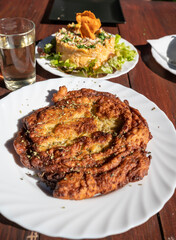Dinner at guachinche, typical Canary Island establishment on Tenerife, where locally produced white or red wine served accompanied by homemade traditional food, oil-fried corn tortilla
