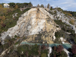 Aerial view on free hot thermal springs and pool in nature park Dei Mulini, Bagno Vignoni, Tuscany, Italy