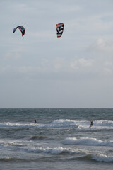 Water sport at cold winter water of Tyrrhenian sea between two touristic towns Sperlonga and Terracina in Lazio, Italy