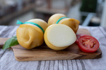 Italian cheeses collection, smoked scamorza pear shaped cheese from small cheese farm in South Italy