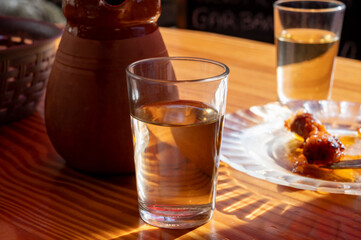Dinner at guachinche, typical Canary Island establishment on Tenerife, where locally produced white or red wine served accompanied by homemade traditional food.