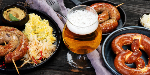Grilled German sausages on wooden background.
