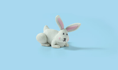 Crafty easter bunny handmade from plasticine on blue background