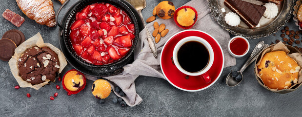 Dessert table with all kinds of cakes and snacks.