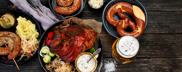 Grilled German sausages on wooden background.