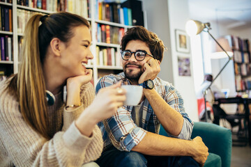 Happy couple in love talking on a date in a cafe.