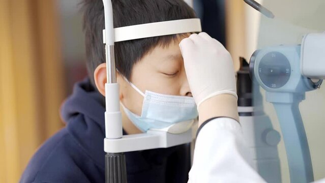chinese teenager in eyesight service in modern eye hospital
