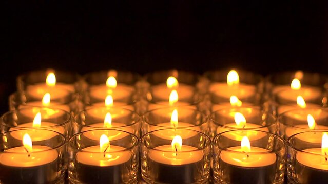In memoriam.  Remembrance candles flickering - Room for copy, Shallow DOF