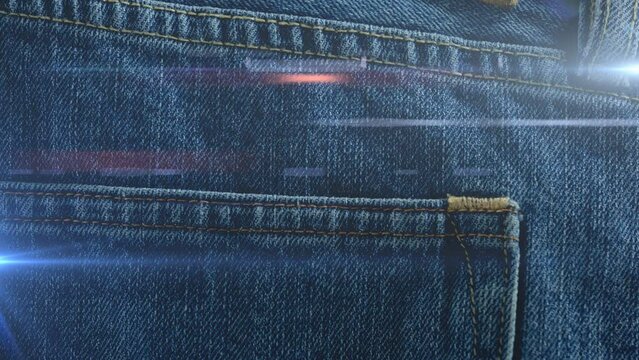 Animation of light spots over denim trousers