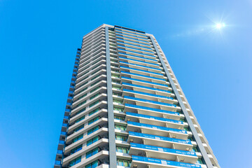 Fototapeta premium Landscape photograph looking up at a high-rise apartment_c_70
