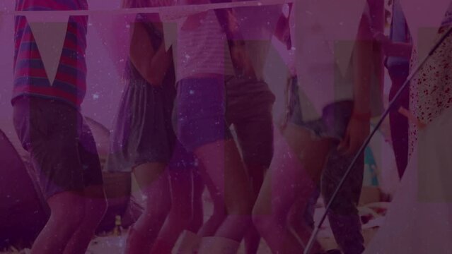Animation of funk text in green over friends dancing outdoors at campsite