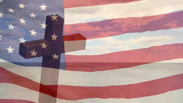 Animation of christian cross and clouds over waving flag of usa