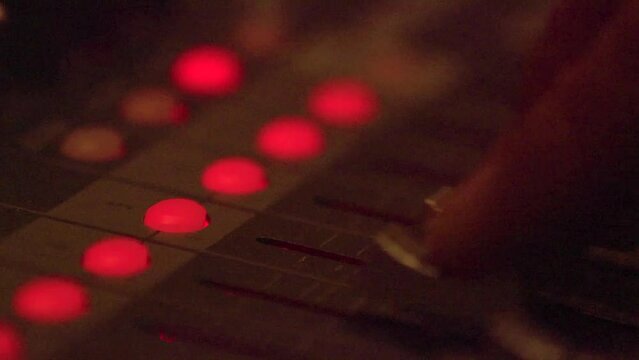 Professional multitrack sound recording, setting levels. Dimmed lights 2