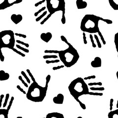 black and white seamless pattern with imprint of hands and hearts. Cartoon style. Children monochrome endless texture. Vector illustration
