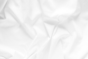 White fabric texture background. Cloth soft wave. Creases of satin, silk, and cotton.