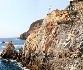 Fototapeta na wymiar Famous diving cliff La Quebrada and Pacific Ocean, Acapulco, Mexico