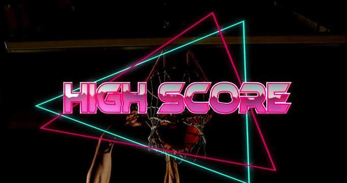 High score text over neon banner against midsection of male basketball player making slam dunk