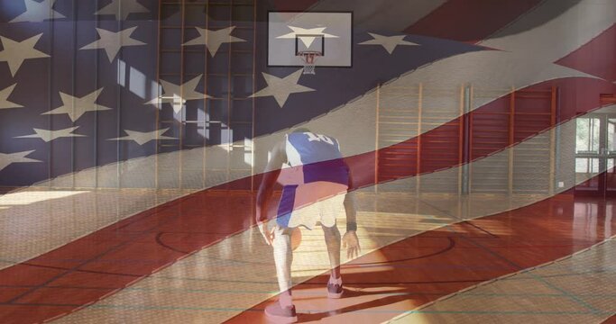 American flag waving against african american male basketball player practicing basketball