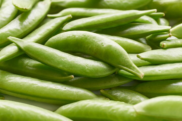 Closeup of fresh organic sugar snap peas or snap peas. Vegetable background with selective focus.  ...